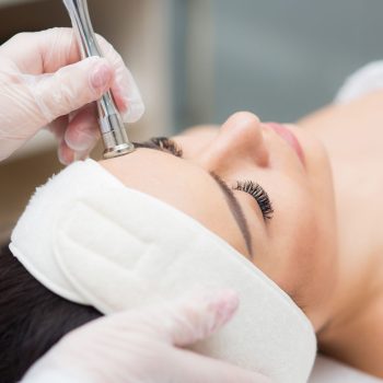 portrait-of-a-woman-receiving-diamond-microdermabr-2022-05-31-13-58-53-utc